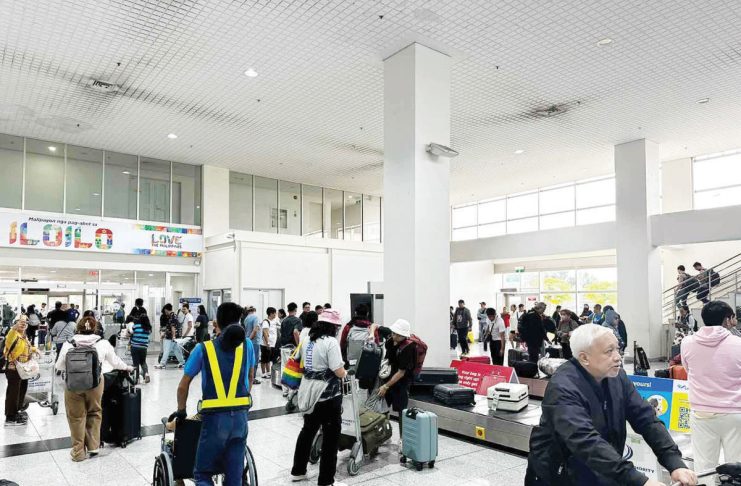 The Department of Tourism Region 6 is hoping to have more international direct flights to and from Iloilo following the resumption of flights from Iloilo to Hong Kong and from Iloilo to Singapore last year. Photo shows arriving passengers from Singapore claiming their baggage at the baggage claim area of the Iloilo International Airport. PHOTO COURTESY OF PDEA REGION 6