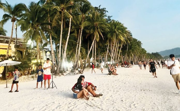 Visitors to Boracay Island pay P150 each in terminal and environmental fees, plus an additional environmental fee upon departure, alongside boat fare costs. MAI LADIAO PHOTO