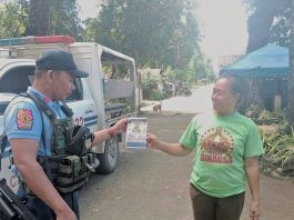 Dumalag police conduct community engagement thru dialogue and distribution of infographic materials related to the prohibited acts during election period, strict implementation of the Commission on Elections gun ban, and anti-illegal drugs campaign, among others in Barangay Poblacion, Dumalag, Capiz, on March 13, 2025. DUMALAG MUNICIPAL POLICE STATION PHOTO