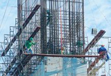 Workers construct the foundation of a building along Timog Avenue in Quezon City on Feb. 18, 2025. The Philippine Statistics Authority reported on Friday, March 21, 2025, that construction activities from approved building permits reached 12,526 in January this year. PNA PHOTO BY ROBERT OSWALD P. ALFILER