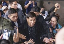 Former president Rodrigo Duterte arrives inside the Southorn Stadium during a thanksgiving gathering organized by Hong Kong-based Filipino workers for the former populist president in Hong Kong on Sunday, March 9. The following day upon his return to Manila, Duterte was arrested upon the order of the International Criminal Court for the charge of “crimes against humanity”. AP