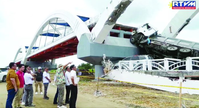 President Ferdinand R. Marcos Jr. visits the site of the collapsed Cabagan-Santa Maria Bridge in Isabela province with Department of Public Works and Highways’ Secretary Manuel Bonoan. He said weak design elements contributed to the collapse, particularly the use of non-cable suspension to support the bridge. PCO