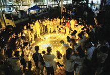 The Iloilo Provincial Government spearheads “Ligum-Dulom”, an Earth Hour observance, at the capitol lobby on March 22 from 8:30 p.m. to 9:30 p.m. Photo shows participants lighting candles in the shape of the Earth Hour symbol at the capitol ground in March last year. EMB 6 PHOTO