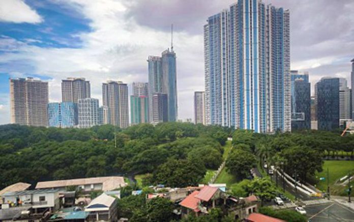 The skyline and business district of Bonifacio Global City in Taguig City on Oct. 4, 2024. The Philippines' economic growth is expected to grow by more than 6 percent in 2025, Sun Life Investment Management and Trust Corporation and Standard Chartered said. PNA PHOTO BY JOAN BONDOC