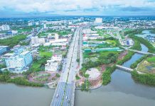 A bird’s-eye view of Iloilo City’s Mandurriao district, especially the New Business District, reveals a landscape transformed by rapid urban development. The district has become a vibrant hub of activity with high-rise buildings housing business process outsourcing (BPO) and other office spaces, modern residential complexes, and bustling commercial spaces. The photo also illustrates that despite the modernization, Iloilo City strikes a balance with green initiatives. This is evident in the clean Iloilo River, thriving mangroves, and well-maintained green open spaces.