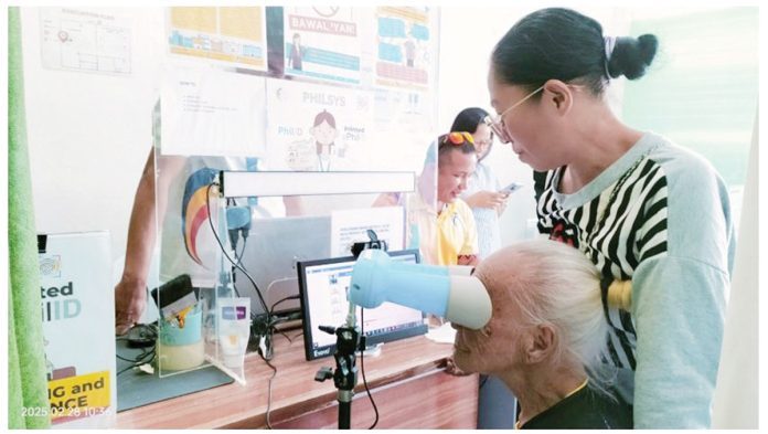 Susana Gallarde Garmay, a 101-year-old centenarian from Barangay Igang, Nueva Valencia, Guimaras, completes her National ID registration at the Philippine Statistics Authority-Guimaras on February 28, 2025. PSA-GUIMARAS