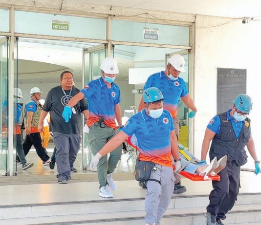 Rescue teams carry out an emergency evacuation during an earthquake drill at the Iloilo Provincial Capitol, testing the effectiveness of response operations. Photo by Dharlyn Mae Qubing, Intern, University of Antique