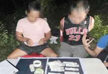 Plain-clothed police operatives conduct an inventory of the items recovered from a drug suspect in Mandurriao, Iloilo City. Authorities recovered 70 grams of shabu, worth P476,000. ICPO PHOTO