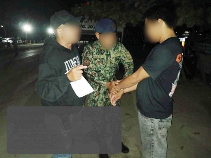 Policemen handcuff this 41-year-old construction worker from Jaro, Iloilo – a rape suspect and Western Visayas’ No. 5 most wanted person. The arrest took place in Barangay Yapak, Boracay Island in Malay, Aklan on March 3. PRO-6 PHOTO