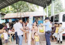 Officers of the Toboso Municipal Station led by assistant chief, Police Captain Armel L. Lasap, provide assistance and security during the distribution of relief goods to evacuees affected by the armed conflict in Barangay General Luna, Toboso, Negros Occidental, on March 19, 2025. TOBOSO MPS PHOTO