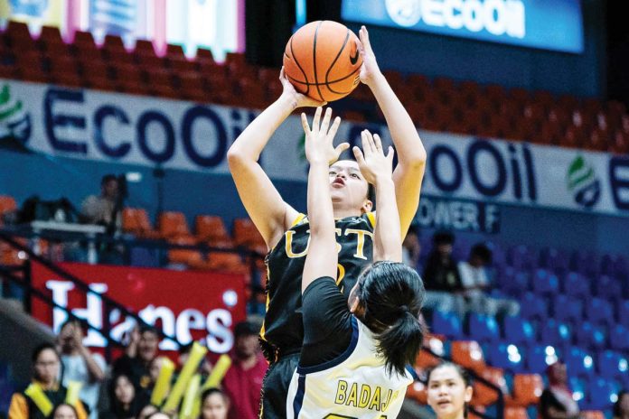 Sandra Abrantes of the University of Santo Tomas Junior Growling Tigresses goes for an inside hit. UAAP PHOTO