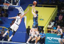 Basilan Viva Portmasters’ Sherwin Concepcion tries to defend the shot of Nueva Ecija Rice Vanguards’ John Wilson. MPBL PHOTO