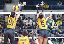 Negrense Angel Canino of De La Salle University Lady Spikers scores against the defense of Jean Asis of Far Eastern University Lady Tamaraws. UAAP PHOTO