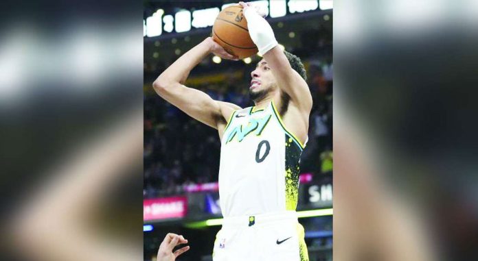 Tyrese Haliburton of Indiana Pacers pulls up for a game-winning triple against the defense of Milwaukee Bucks' Giannis Antetokounmpo. AP