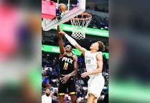 Phoenix Suns' Bol Bol (11) makes a basket past Dallas Mavericks' Kessler Edwards (20). PHOTO COURTESY OF JEROME MIRON/IMAGN IMAGES