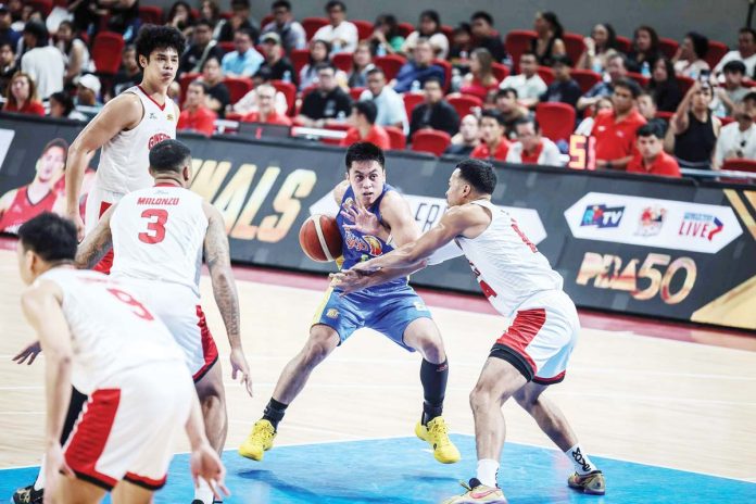 TNT Tropang Giga’s Rondae Hollis-Jefferson tries to make a move against the defense of Barangay Ginebra San Miguel Kings’ Jamie Malonzo and Jeth Troy Rosario. PBA PHOTO