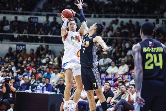 Rain or Shine Elasto Painters’ Caelan Tiongson pulls up for a basket against the defense of TNT Tropang Giga’s John Paul Erram. PBA PHOTO