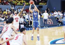 TNT Tropang Giga’s Roger Pogoy shoots over the defense of Barangay Ginebra San Miguel Kings’ Maverick Ahanmisi. PBA PHOTO