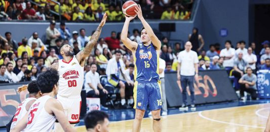 TNT Tropang Giga’s Roger Pogoy shoots over the defense of Barangay Ginebra San Miguel Kings’ Maverick Ahanmisi. PBA PHOTO