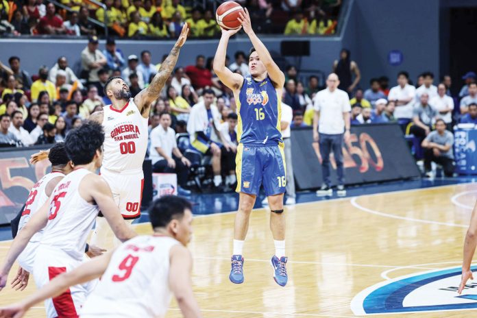 TNT Tropang Giga’s Roger Pogoy shoots over the defense of Barangay Ginebra San Miguel Kings’ Maverick Ahanmisi. PBA PHOTO