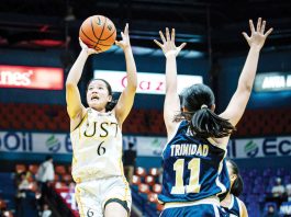 Negrense Barby Dajao of the University of Santo Tomas Junior Growling Tigresses goes for an inside hit. UAAP PHOTO