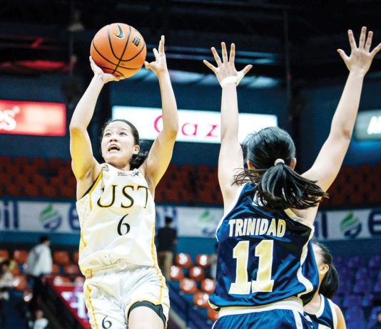 Negrense Barby Dajao of the University of Santo Tomas Junior Growling Tigresses goes for an inside hit. UAAP PHOTO