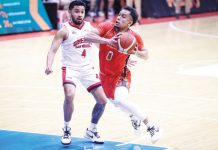 Ilonggo Juan Paolo Taha of NorthPort Batang Pier eludes the defense of Barangay Ginebra San Miguel Kings’ Rhon Jay Abarrientos for an inside hit. PBA PHOTO