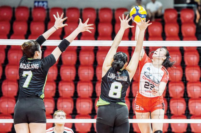 Ilongga Ma. Shaya Adorador of Chery Tiggo Crossovers tries to score against the defense of NxLed Chameleons’ May Luna. PVL PHOTO