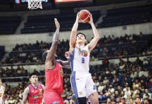 TNT Tropang Giga’s Calvin Oftana attempts to score against the defense of Rain or Shine Elasto Painters’ Deon Thompson. PBA PHOTO