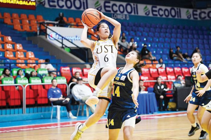 Bacolodnon Barby Dajao of University of Santo Tomas Junior Growling Tigresses goes for a layup. UAAP PHOTO